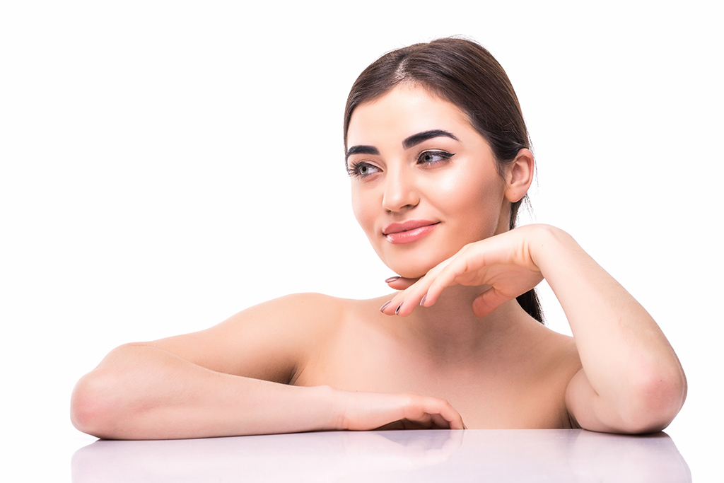 face of attractive young and healthy woman with nude makeup. health care, spa, makeup, face lifting concept.